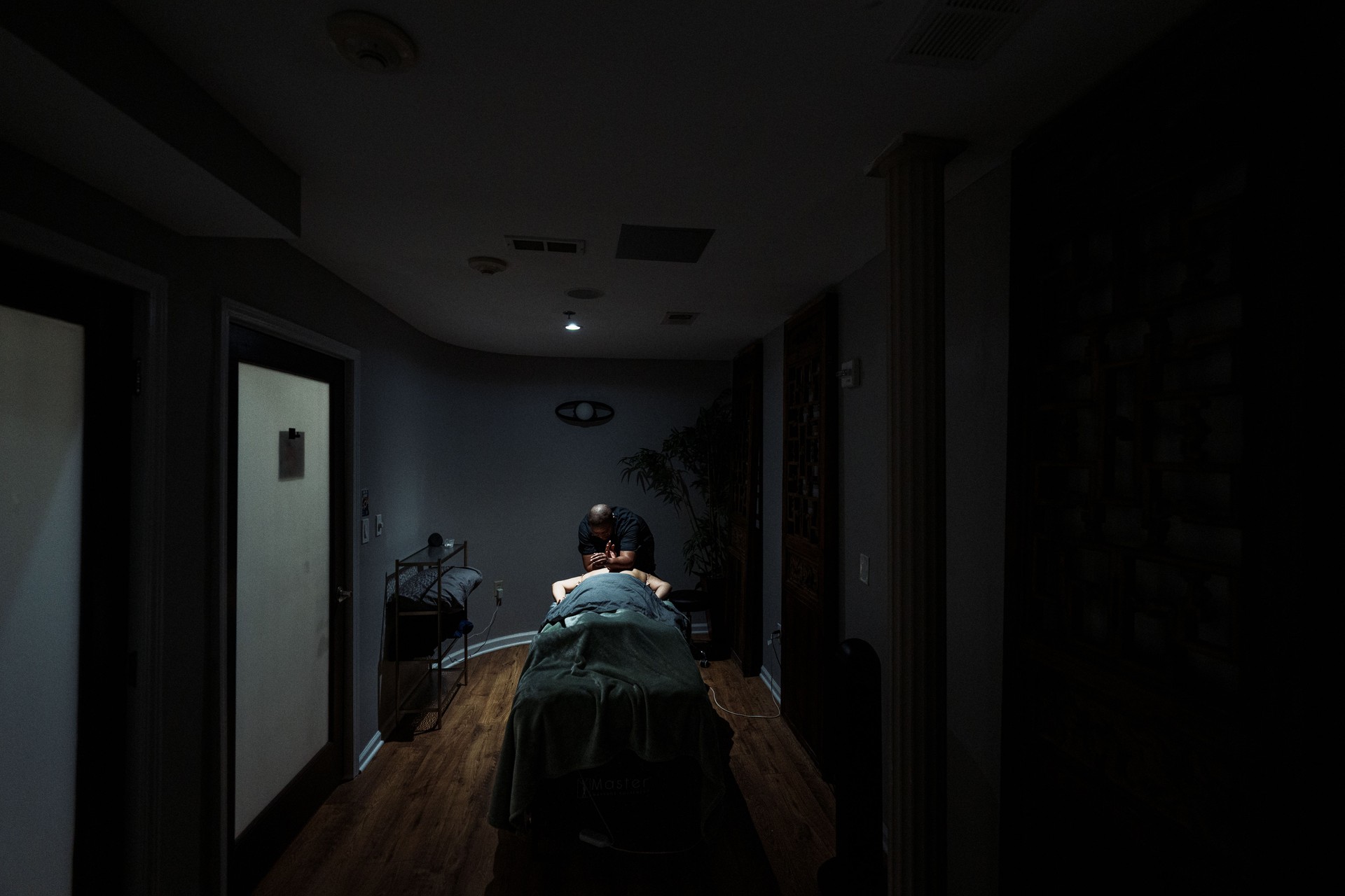 Massage therapist working at luxury spa